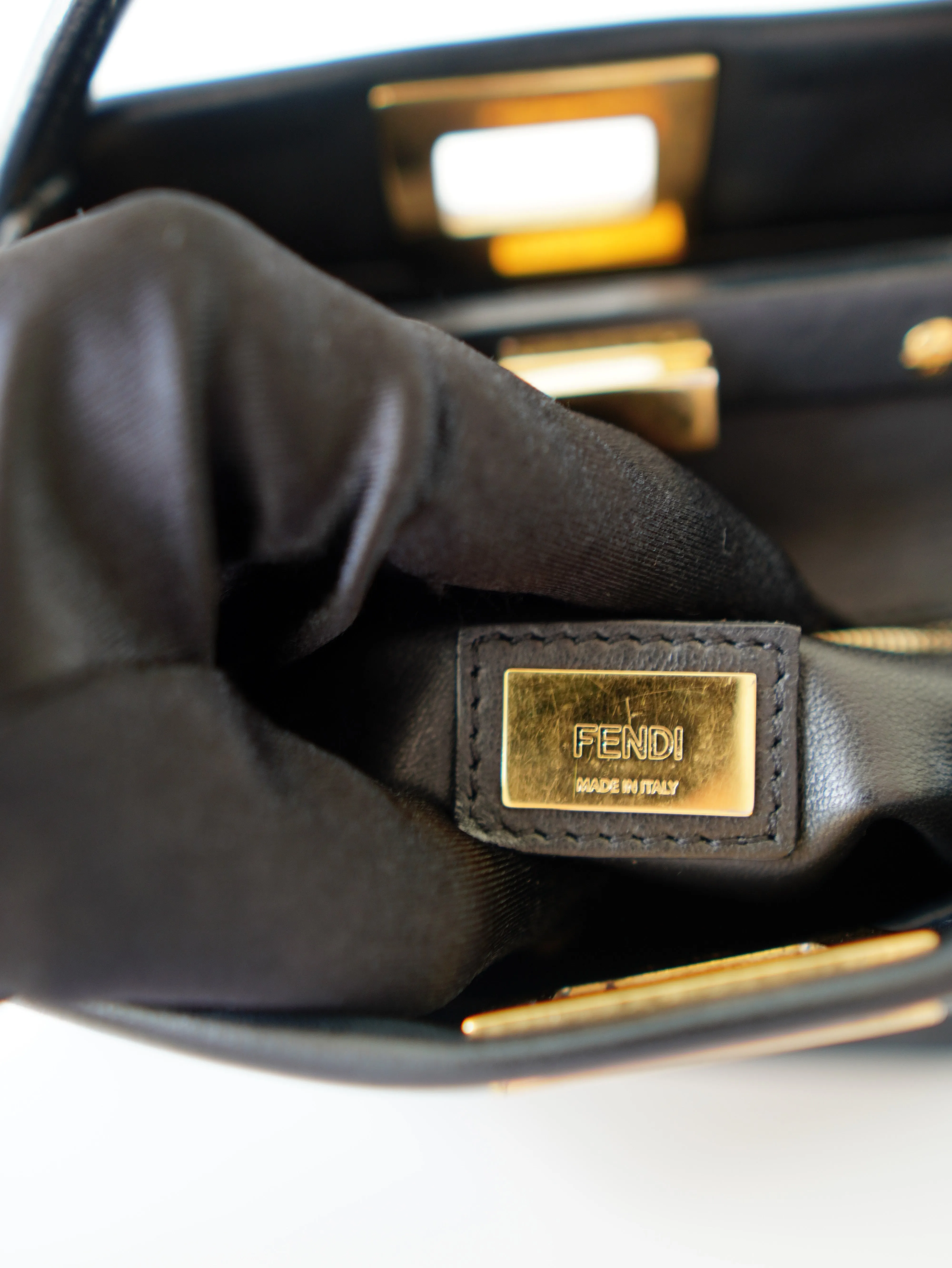 <b>FENDI</b> <br>Iconic Mini Peekaboo